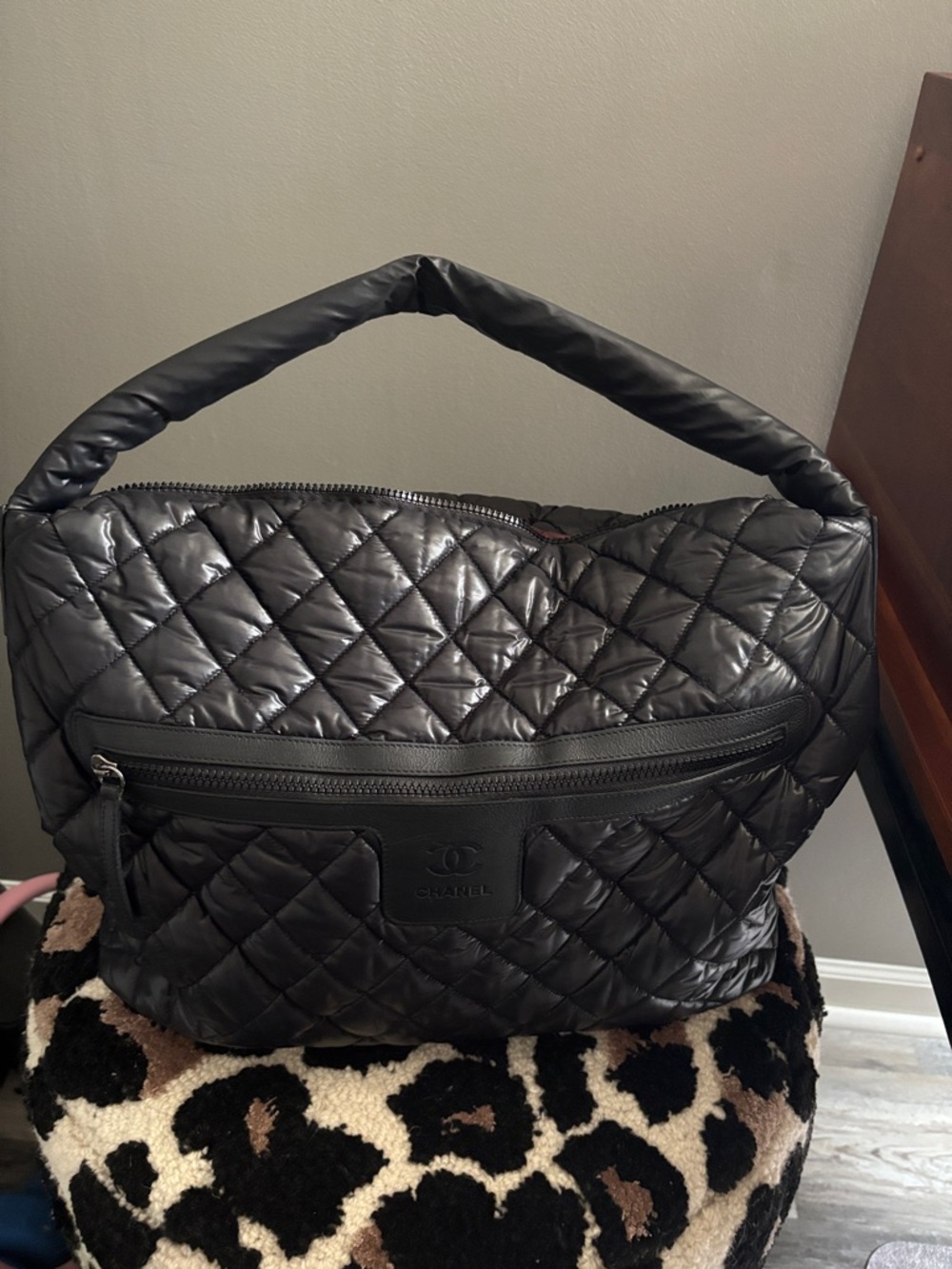 CHANEL Black Quilted Puffer Bag with Embossed CC Patch